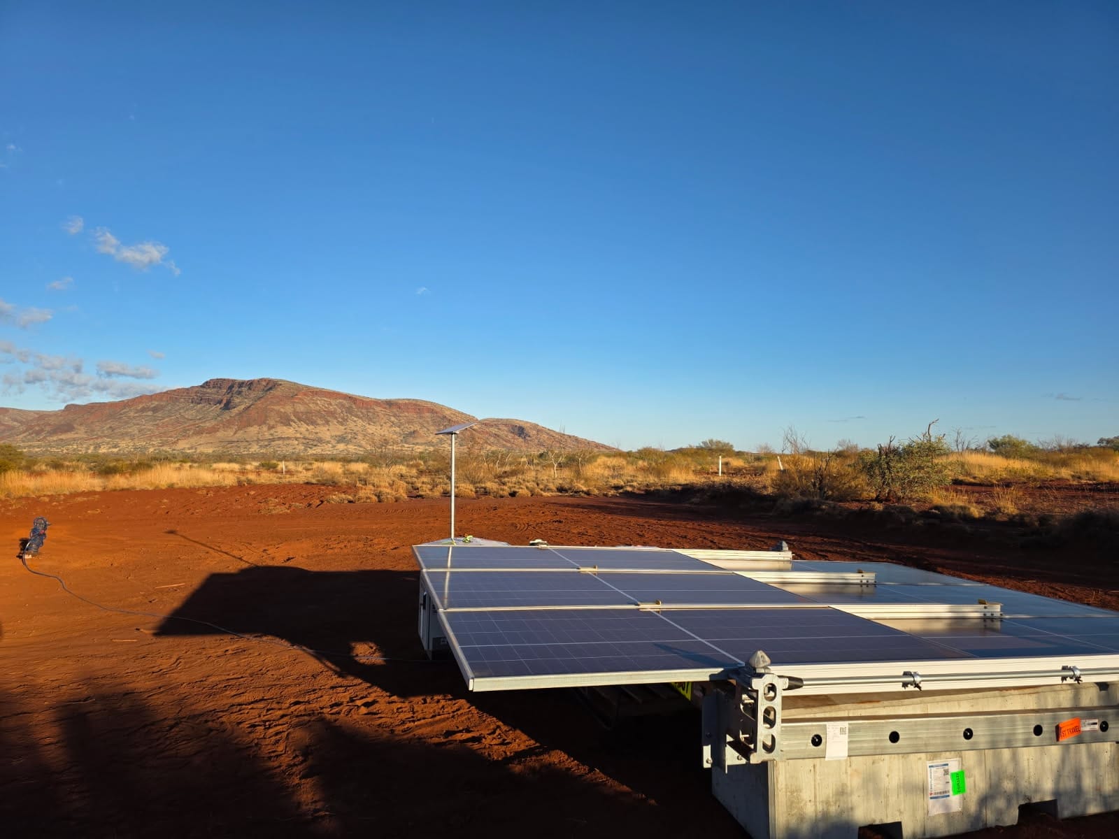 solar array 3kW mounted on block at a remote mining site. It is charging the battery energy storage unit to power equipment.
