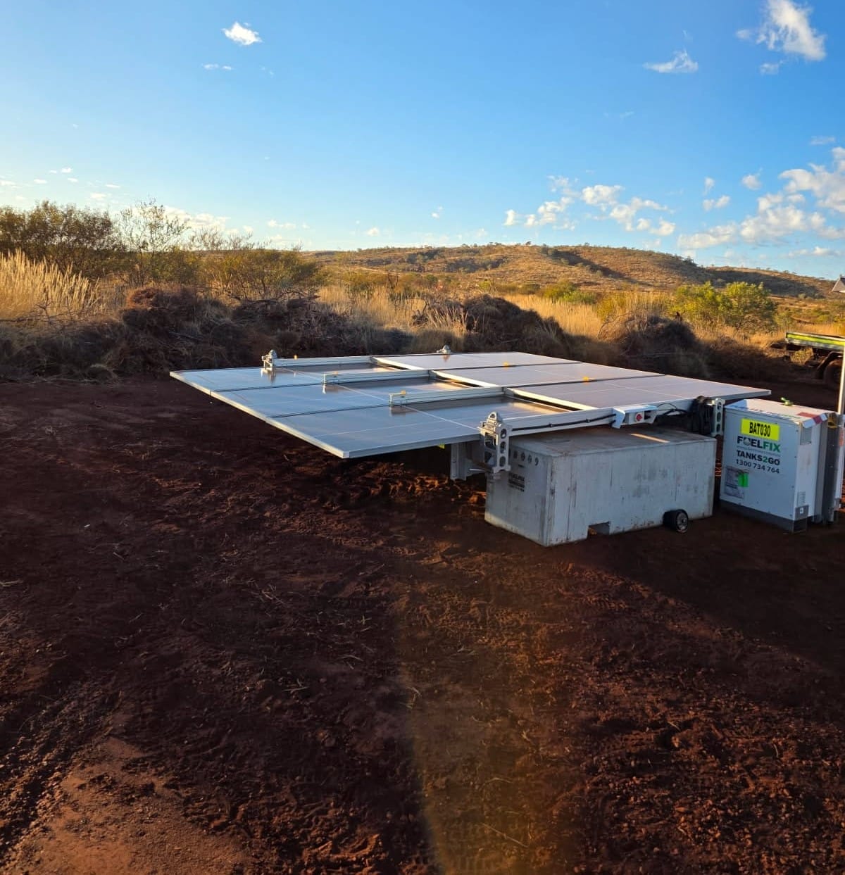 solar array 3kW mounted on block at a remote mining site. It is charging the battery energy storage unit to power equipment.